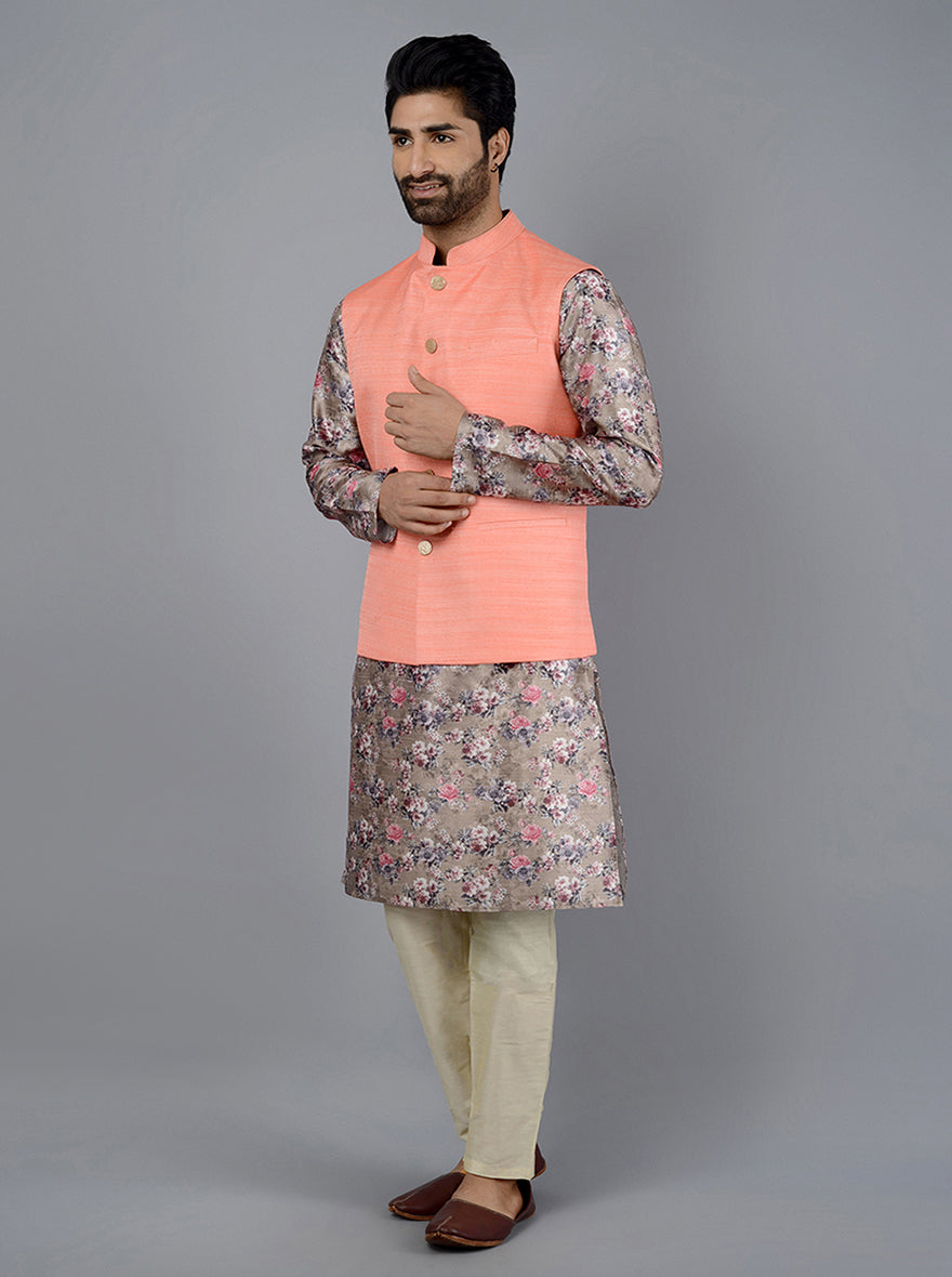 Perfect for any occasion, this Coral Peach Bandhgala Jacket combines elegance with practicality through its flap pockets.