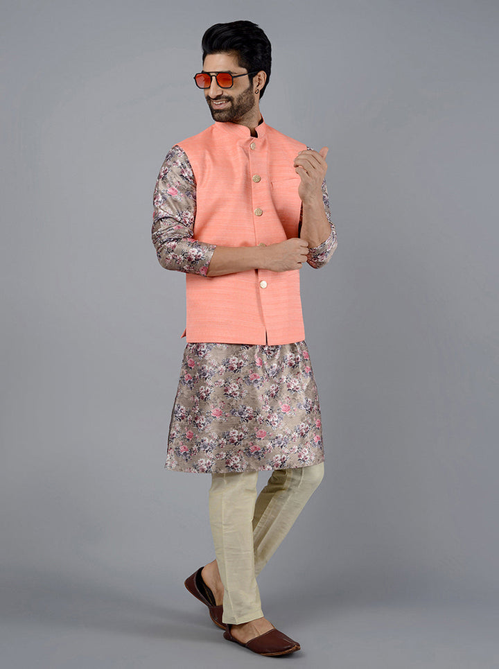 This vibrant Coral Peach Bandhgala Jacket is ideal for celebrations, adding sophistication with its self-textured fabric.