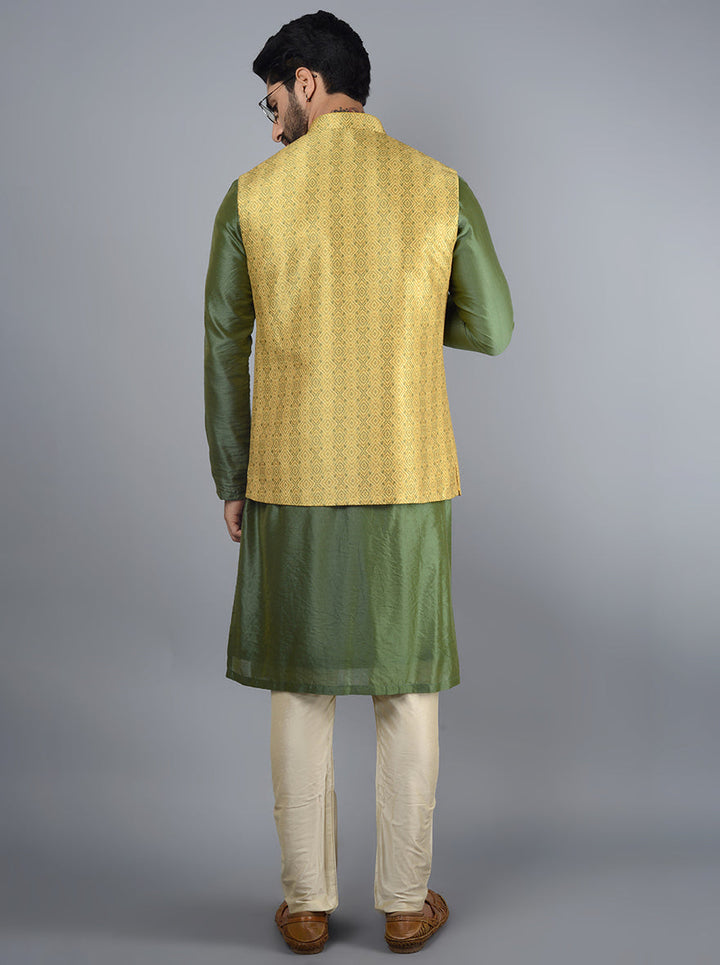 Experience elegance with this mustard yellow and green bandhgala, designed with pockets and a striking abstract print for men’s ethnic wear.