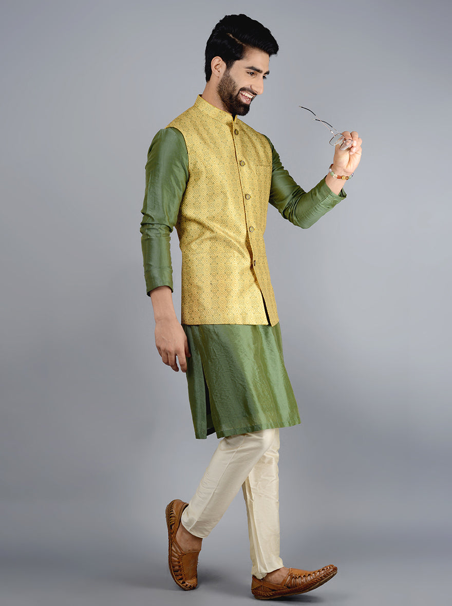 This silk blend Jodhpuri jacket combines a straight fit with vibrant mustard yellow and green hues, perfect for any festive event.