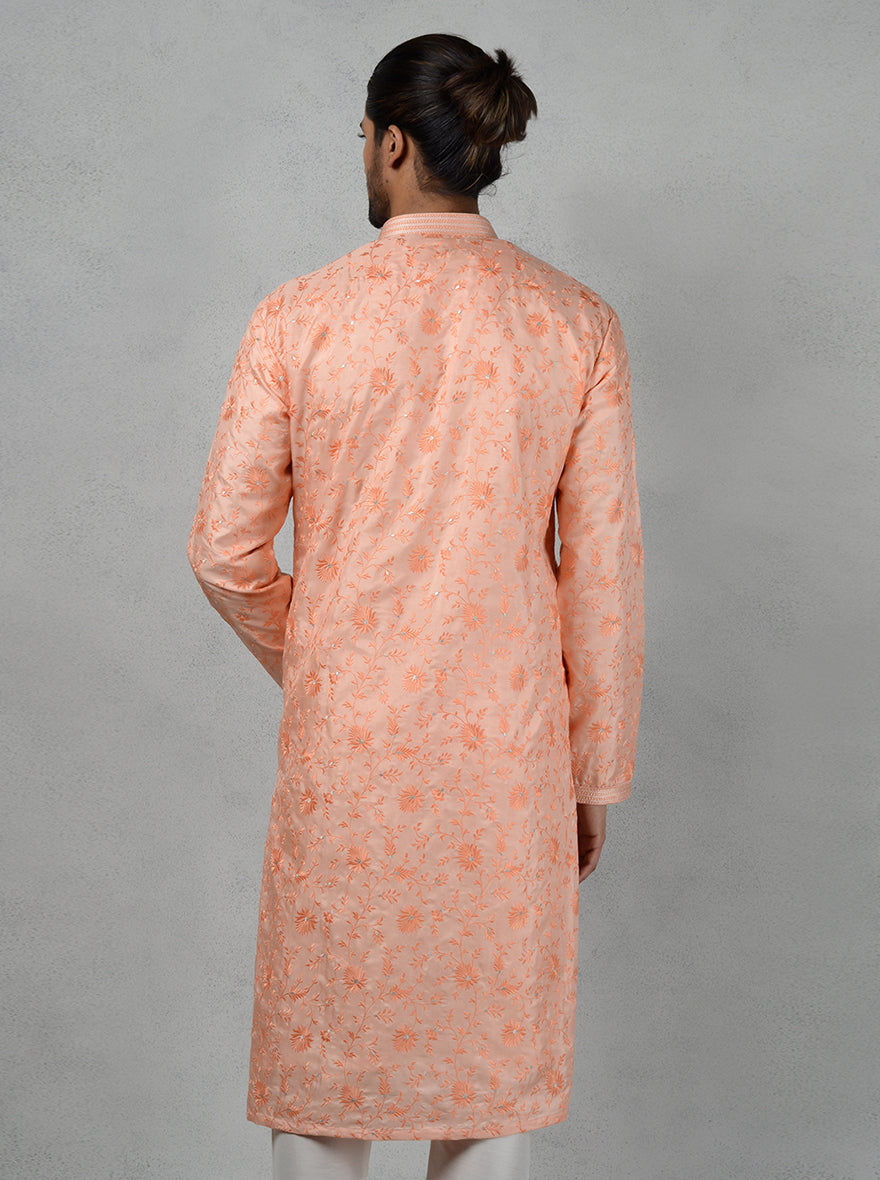 Comfortable peach kurta ideal for festive occasions.