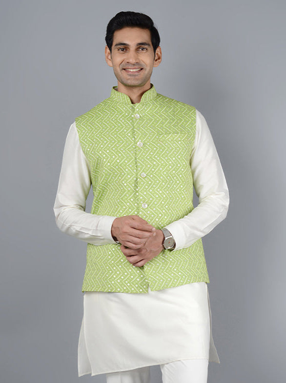 Look refined in this pista and cream bandhgala jacket, perfect for evening festivities and special occasions.