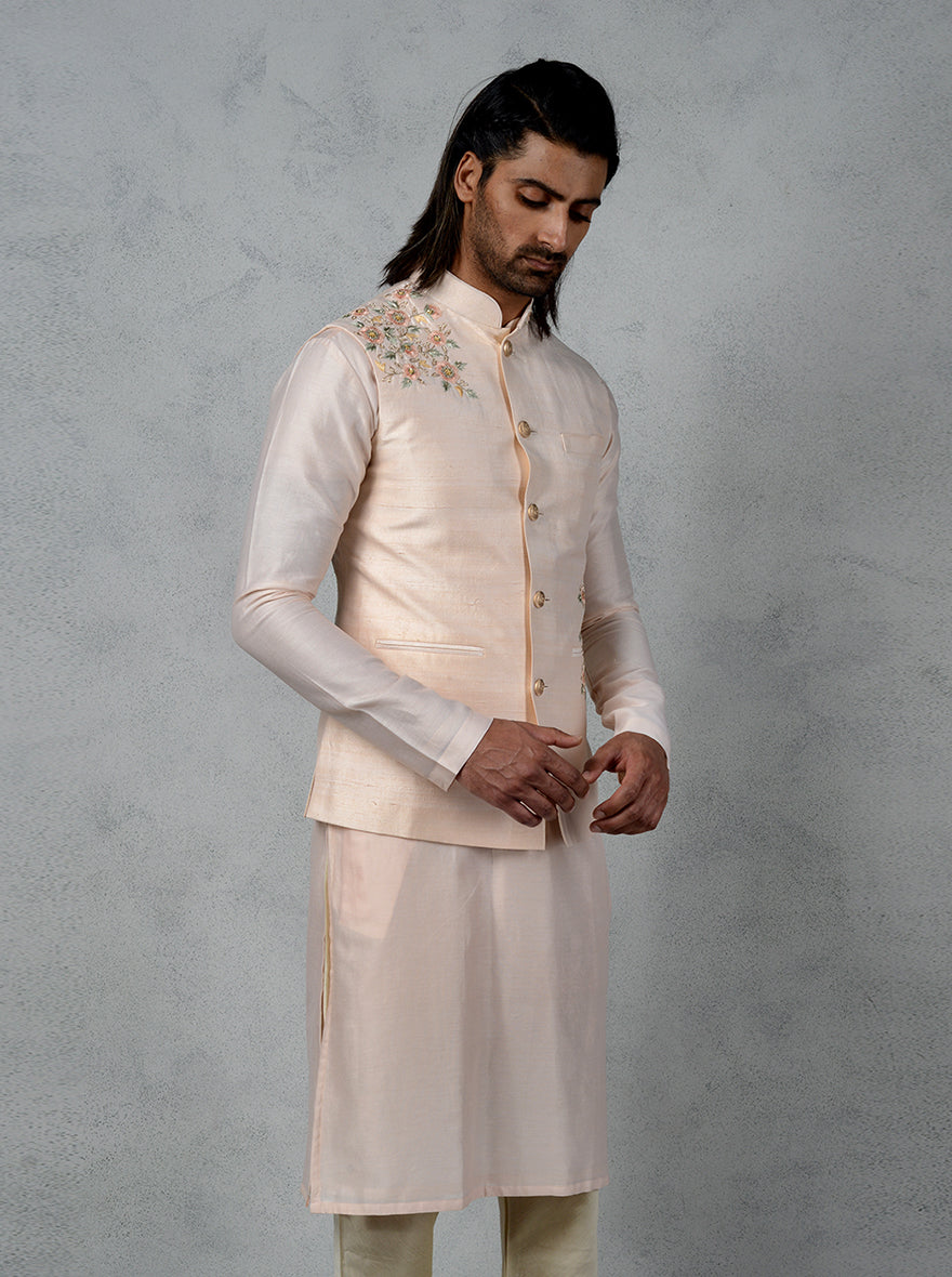 Celebrate in style with this luxurious peach kurta set, designed for modern men in the USA.