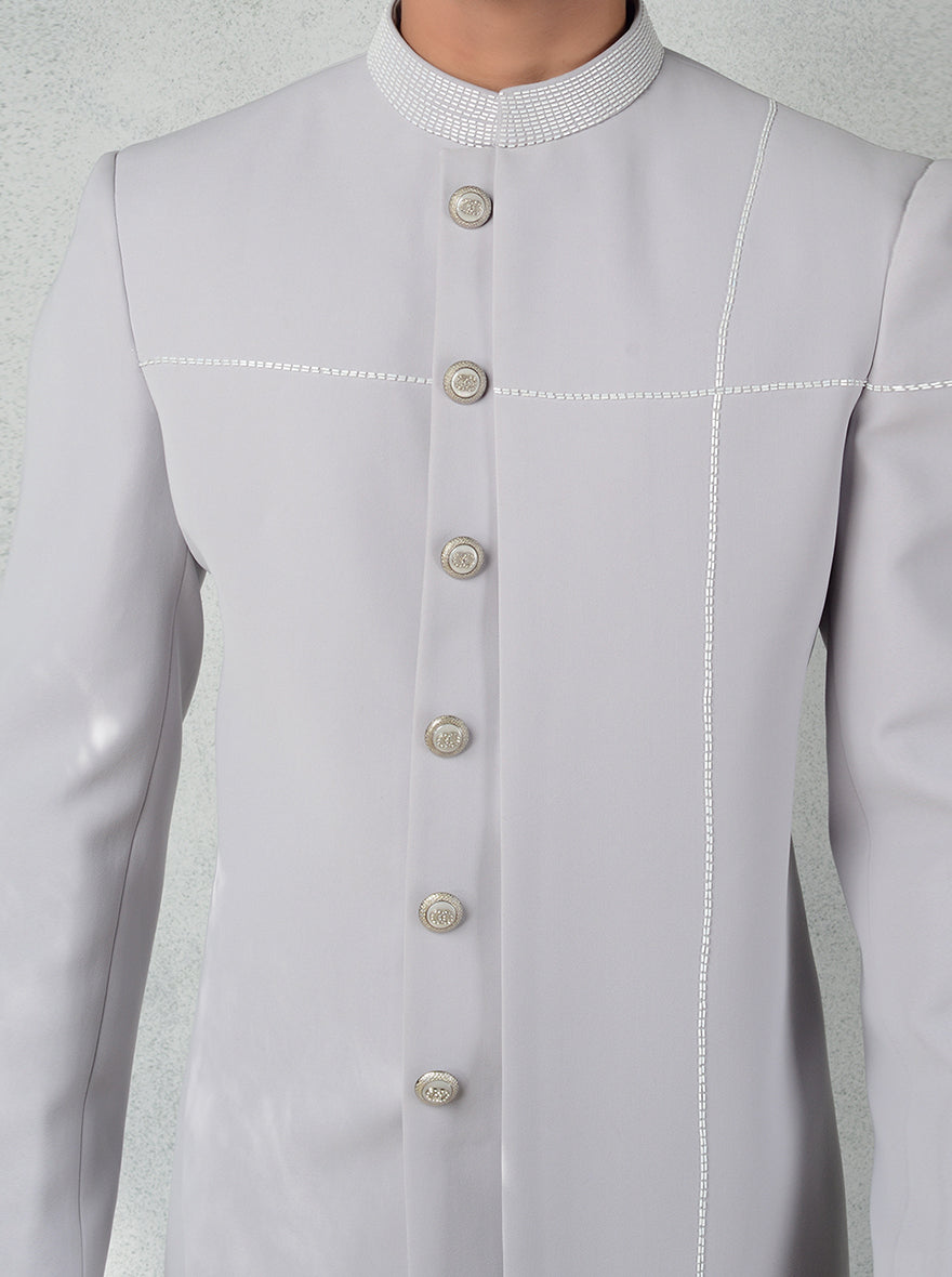 Elegant grey Indo Western kurta with stand collar, cutdana embroidery, and matching pants.